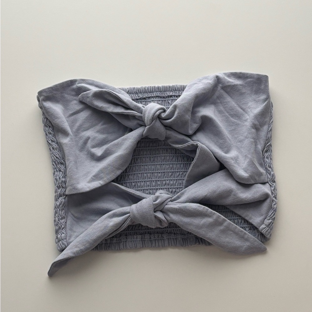 Wilfred light blue smocked tube top with a front tie detail.